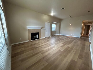 Unfurnished living room with light wood-style flo