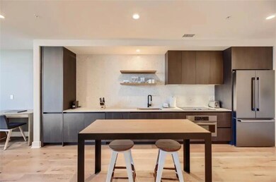 Kitchen with stainless steel appliances, a sink, 