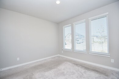 Great natural light, easy footing carpeting and ample wall and floor space make this front room perfect for all your personal uses.