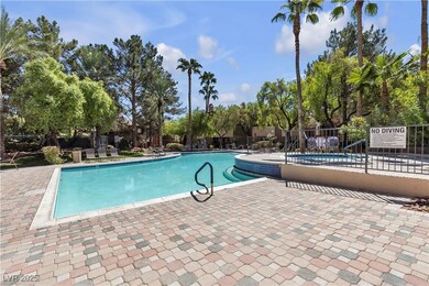 Community pool with a patio area and view of scatt