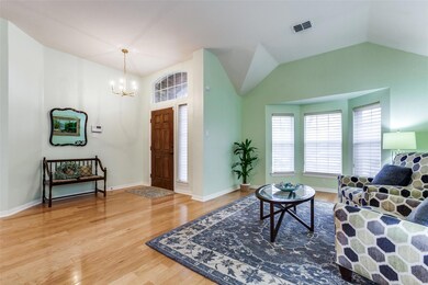 Living room featuring lofted ceiling, an inviting 