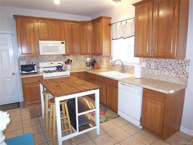 Kitchen with ceramic tile floor, gas stove, glass 