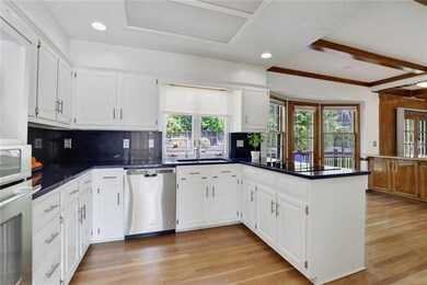 Open concept kitchen with bay window in breakfast 