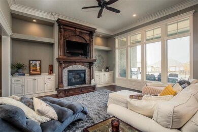 Spacious Great Room with extensive crown moldings.