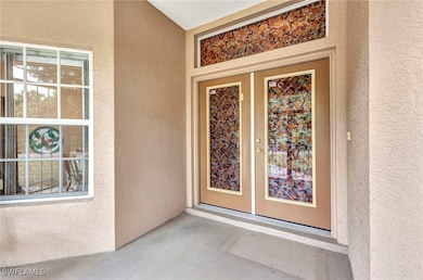 Property entrance with stucco siding