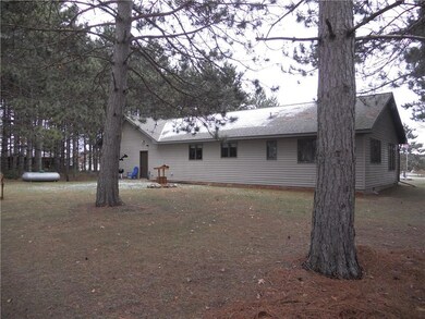 Back yard view around the fire pit sitting on the 15th hole.