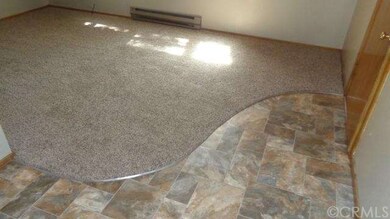New living room carpeting surrounded by new linole