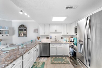 Kitchen with stainless steel appliances, a sink, o