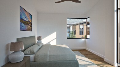 Bedroom featuring wood finished floors and a ceiling fan