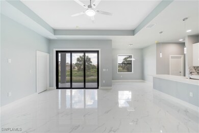 Unfurnished room featuring a raised ceiling, ceili