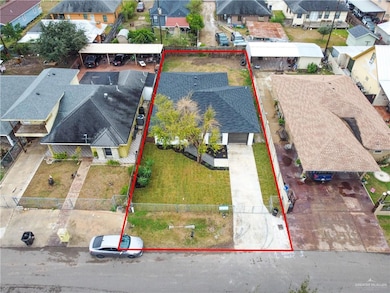 Aerial view of residential area featuring property parcel outlined