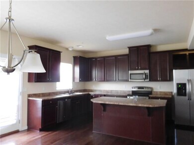 spacious island kitchen with stainless appliances 