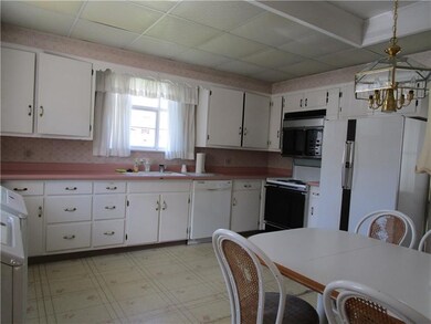 Large eat in kitchen. Check out all the cabinets!