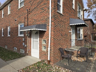 Entrance to property with brick siding