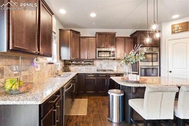 Bright & open kitchen with center island and pantr