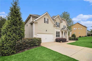Traditional home featuring brick siding, a garage,