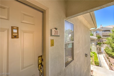 Entrance to property with stucco siding