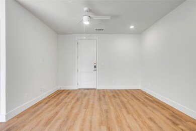 Spare room with light wood-type flooring, a ceilin
