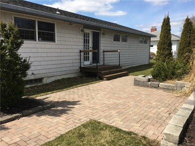 Stone patio out back for enjoying your back yard.