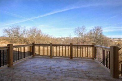 Deck off the kitchen.  Backs up to trees