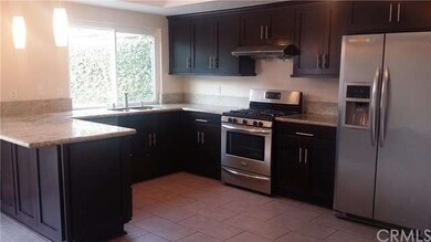 Kitchen with Granite counter tops and Stainless st