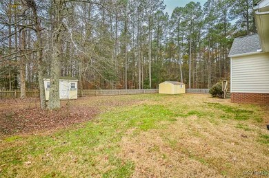 View of yard featuring a storage unit