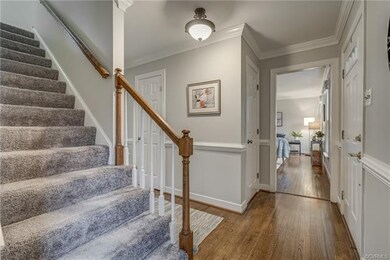 To the right is the spacious living room, which fl
