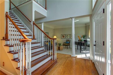 2-story foyer with hardwood floors and lots of natural light, brand new front door and sidelights