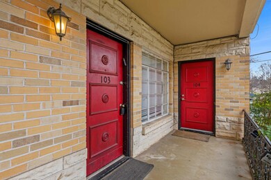 Doorway to property featuring covered porch
