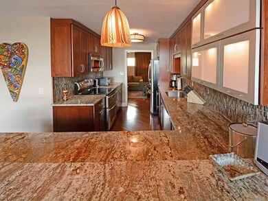 Lighting in the kitchen is provided by a beautiful
