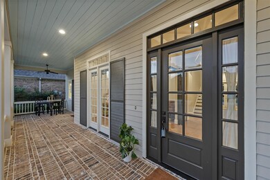 Southern charm at its finest with this fully covered front porch. Ideal for rocking chairs or table!