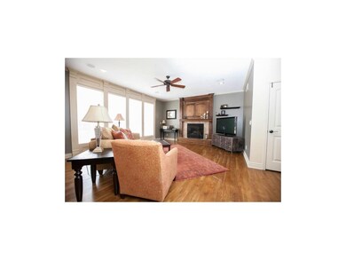 Large family room with tiled fireplace and storage