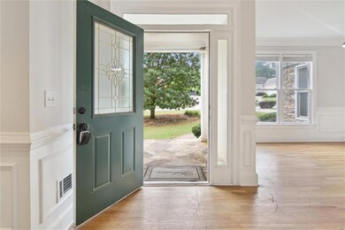 Entrance foyer featuring visible vents, wainscotin