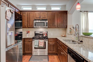 Kitchen with stainless steel appliances, a sink, 