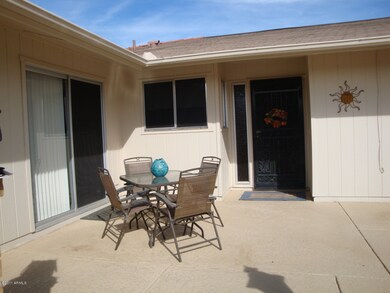 FRONT PATIO W/SLIDING DR TO BREAKFAST AR
