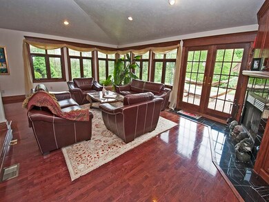 The family room with vaulted ceiling, recessed lig