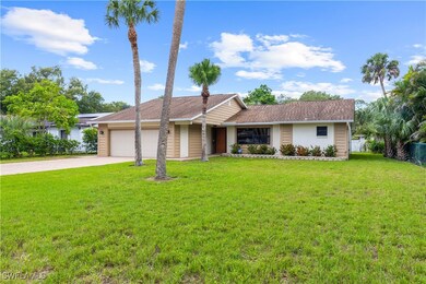 Ranch-style home featuring a garage, a front lawn,