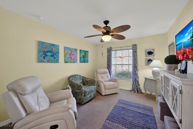 Sitting room with baseboards, ceiling fan, and car
