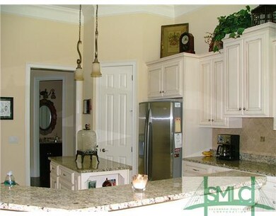 Kitchen. The gourmet kitchen features stainless ap