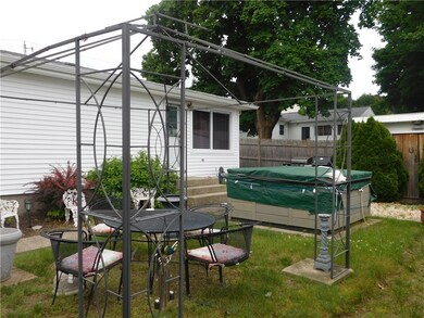 Side yard, with hot tub