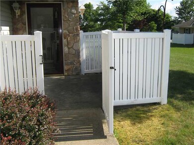 Exterior Front. Private fenced patio
