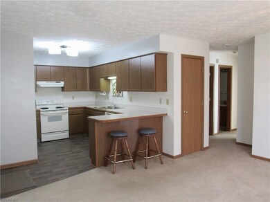 Manageable kitchen with bar for sitting