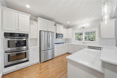 Tons of cabinet space accented by stainless steel appliances