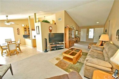 Open floor plan with a vaulted ceiling
