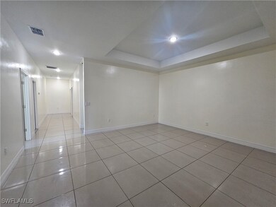 Unfurnished room featuring light tile patterned fl