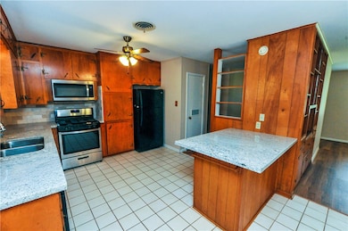Kitchen featuring appliances with stainless steel