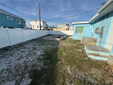 Fenced backyard featuring a vegetable garden