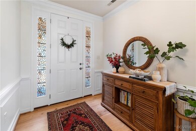 Foyer entrance featuring light hardwood / wood-sty