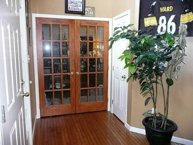Entry/Foyer. FRENCH DOORS TO LIVING ROOM/ DEN