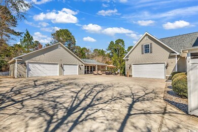 View of property exterior featuring concrete drive